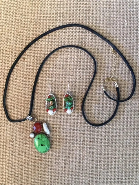 c vasilev custom earrings to compliment her pendant.jpg