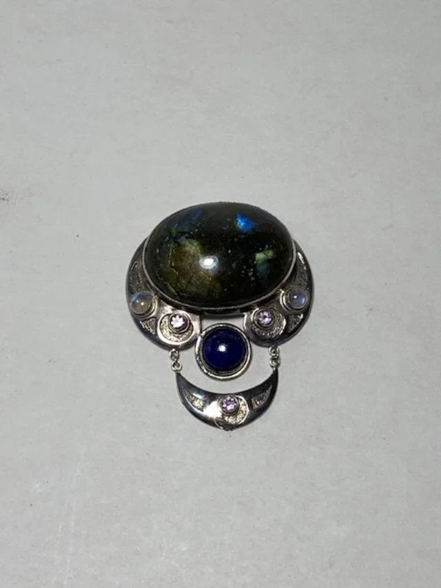 A client had this pendant- that could be worn as a pin or had a bail to be strung.  She never used the piece, but always liked it.  She contacted me to inquire what could be done with it.