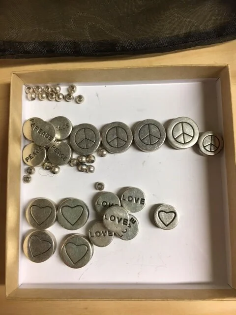 My client had 2 separate bracelets that were strung on elastic.  One broke.  She inquired if I would be able to restring them, but incorporate them into one piece.