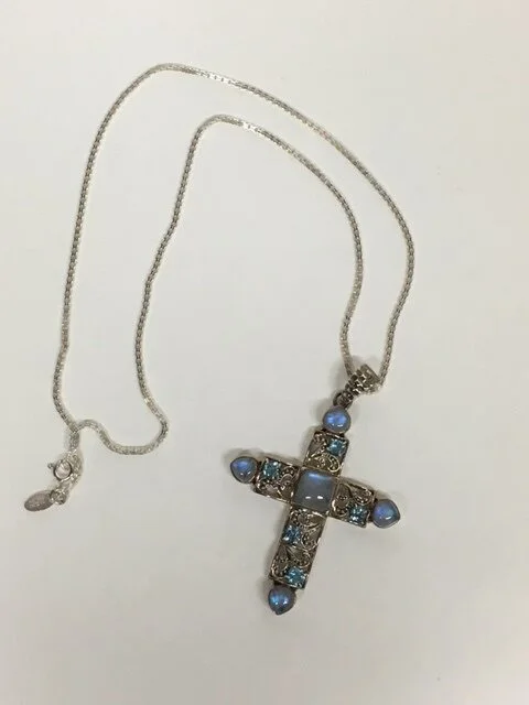 My client had a beautiful and ornate cross that she felt needed some embellishment so that it's beauty would stand out more.