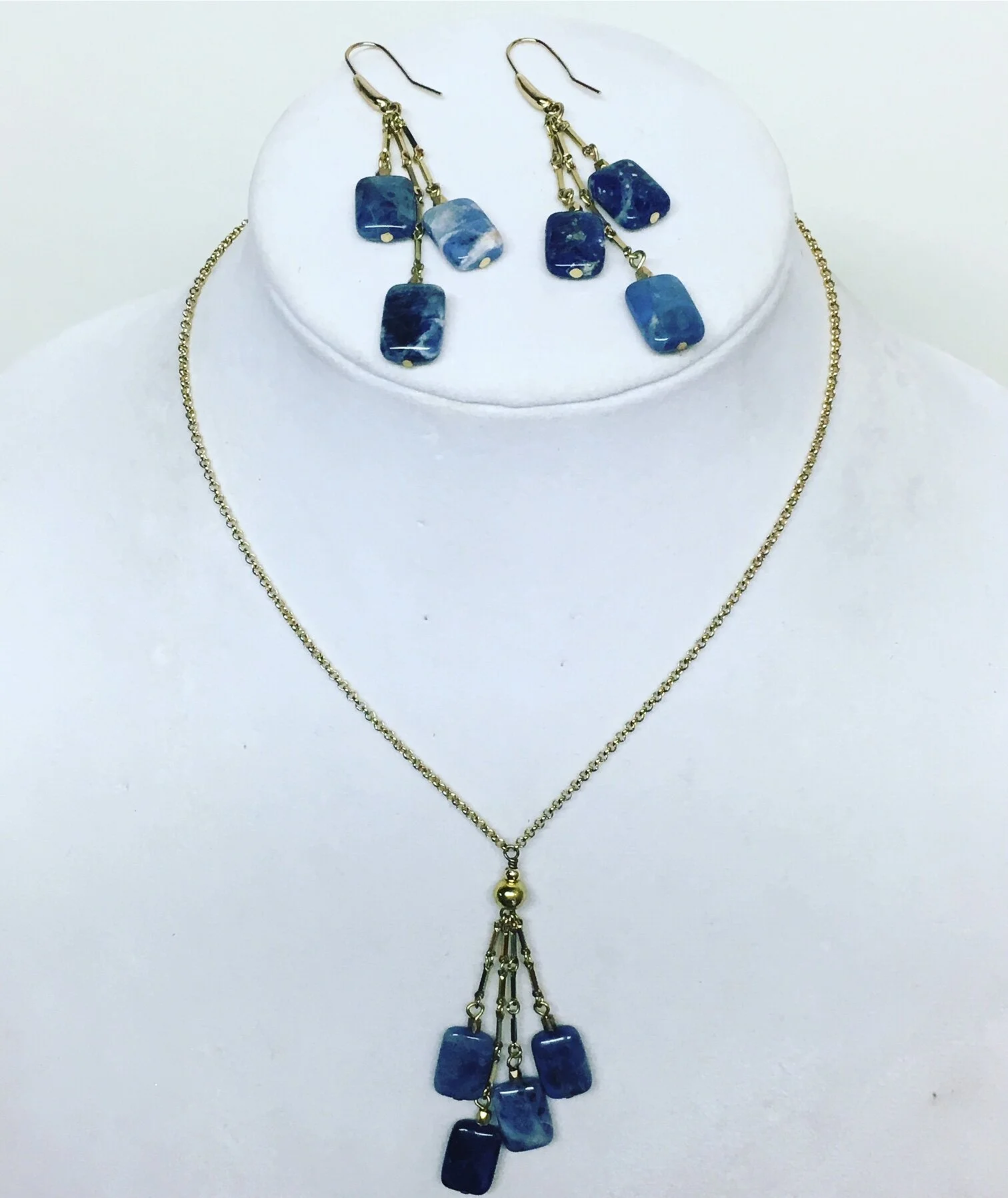 Earrings deconstructed and rebuilt and necklace designed utilizing the extra parts and pieces.