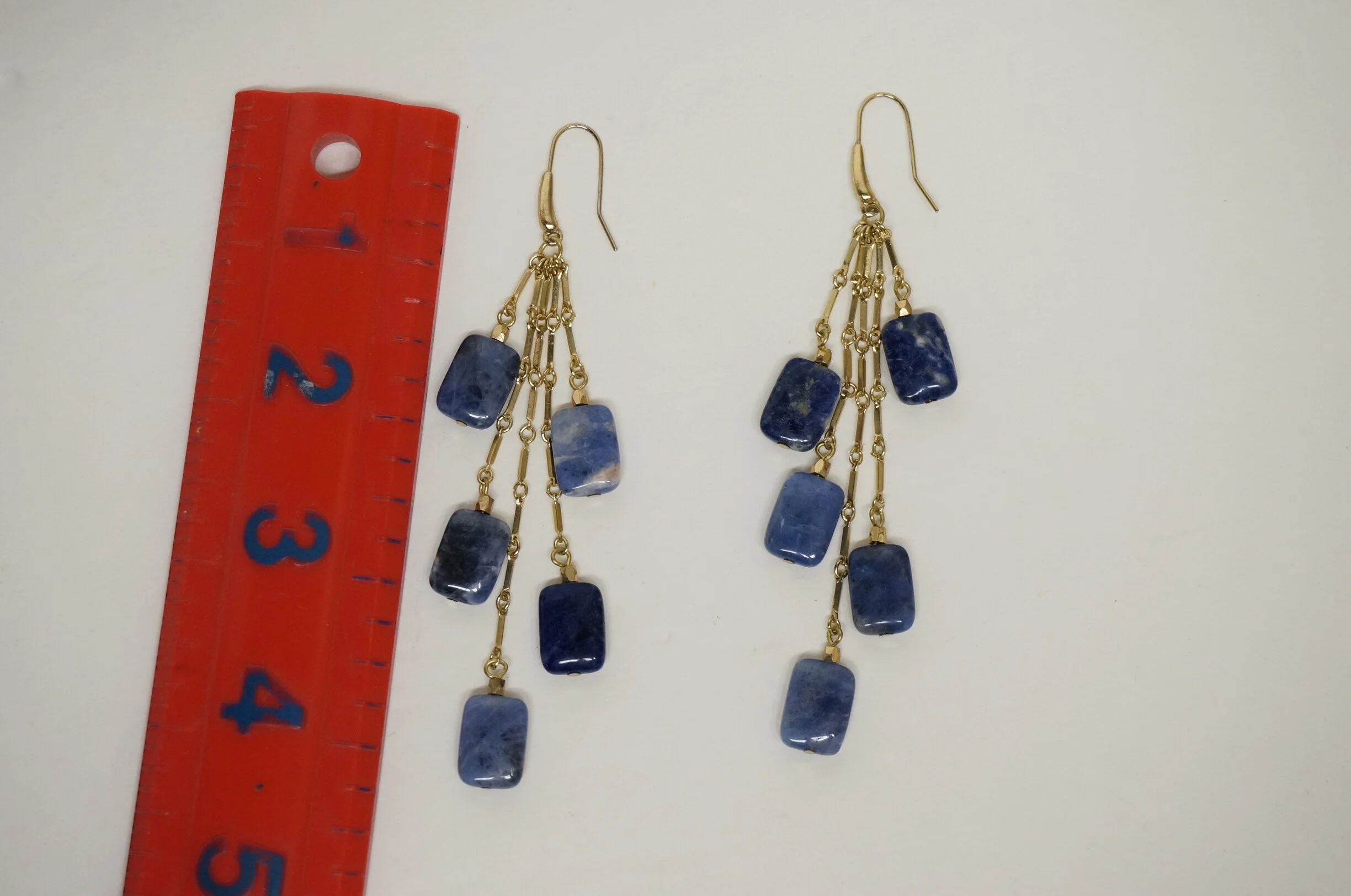 A woman reached out to me via recommendation as she had these lapis earrings, but felt they were too long and too busy for her.  
She wanted to keep the design as close to the original as possible, but make a piece that was more in her comfort zone. 