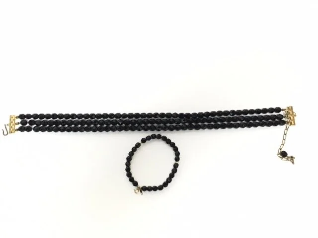 A client of mine had seen that I had designed and fabricated a set for another client using her old black beaded jewelry.  
This client had an old choker necklace and separate bracelet and asked if I would make something similar to what she had admir