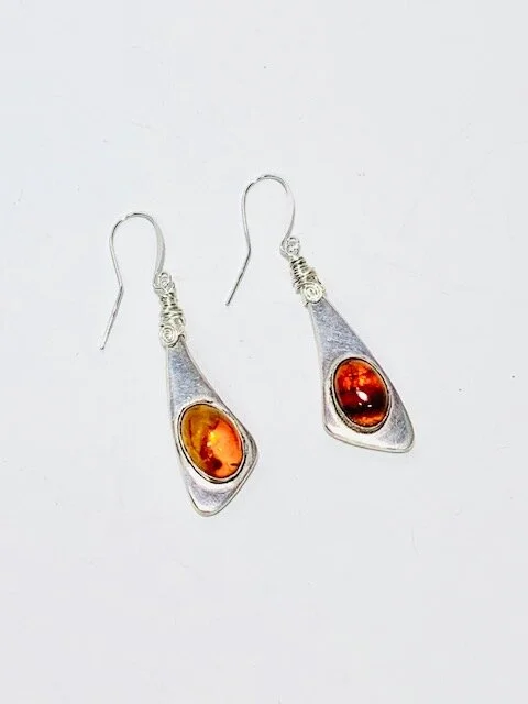 I used the 2 original necklace components and shaved off the remaining solder and silver and wire wrapped them.  What was once a part of a necklace are now matching earrings.
