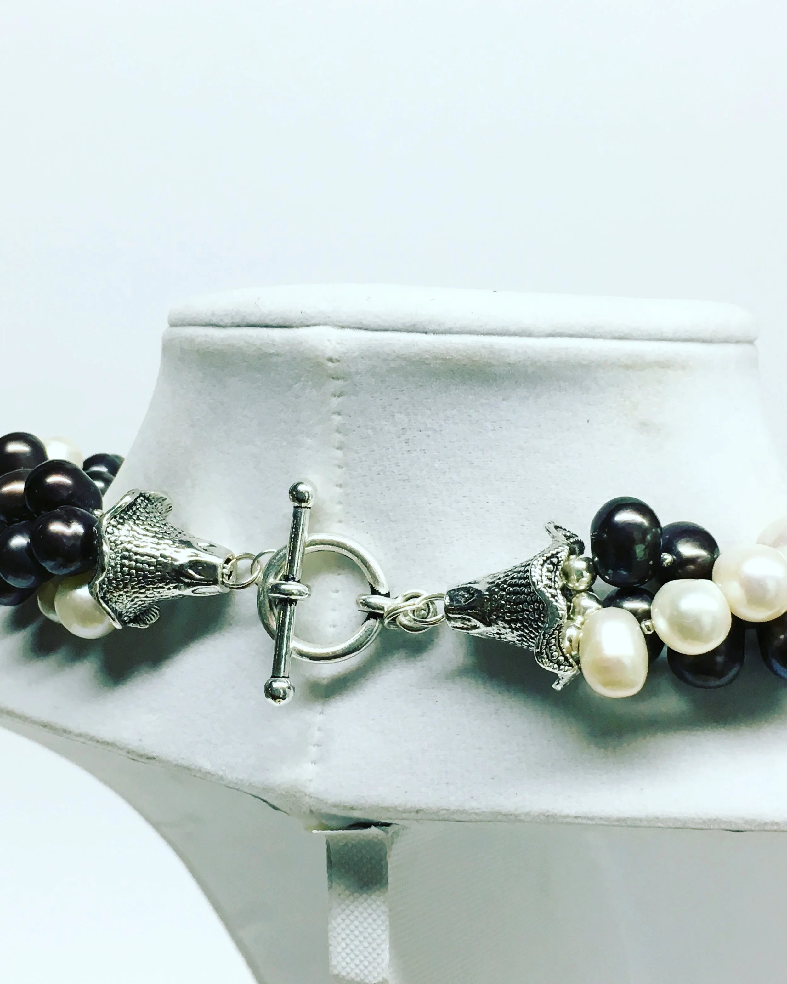 New end caps, sterling silver beads, and toggle closure.