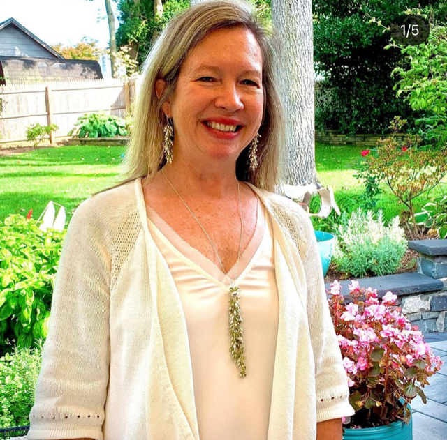 A very happy client! 
Both the earrings and necklace are complementary to her in size, length, and style.  The pieces can be worn together or separately.  