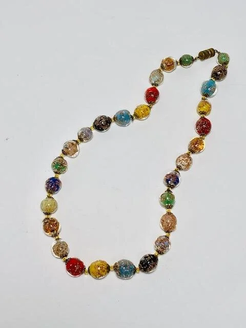 My client had her mothers hand blown glass beaded necklace that she purchased while traveling in Italy many years ago.  
She asked if I would be able to create an updated necklace set for her mom, and with the remaining beads, make earrings for the s