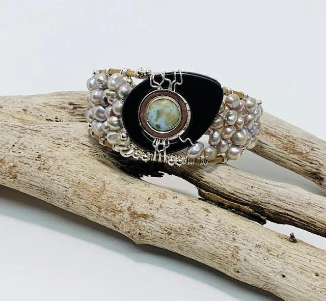 Custom onyx and larimar statement cuff bracelet.  Freshwater pearls, sterling silver, brass.  