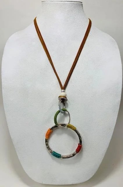 After:  I used synthetic suede, but doubled the cording to add some security.  I also knotted some spots that werent prior to prevent the pendant from swinging around the cording resulting in less stress on the piece.  