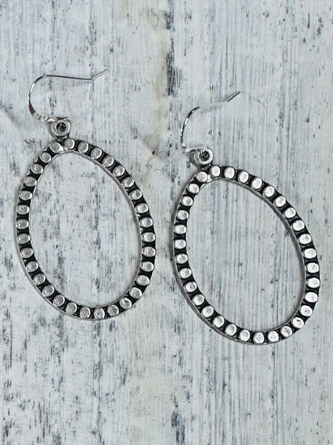 hammered circle flat teardrop hoops flat.jpg