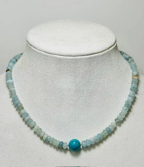 After:  my client also requested I make a necklace similar to one she admired in the Sundance Catalog.  I used natural aquamarine and sterling silver beads along with her original blue bead as the foacl stone.  Sterling silver lobster clasp closure. 