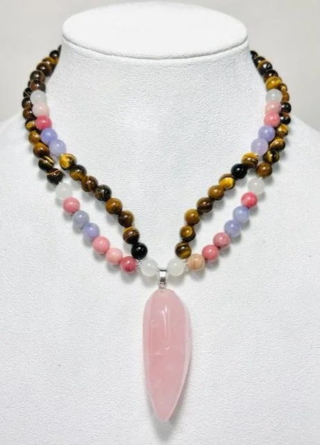 After:   I deconstructed this piece and made it into a double strand necklace keeping the large rose quartz pendant as the focal point.  Added sterling silver beads and large toggle closure.  She absolutely loved the new necklace.  