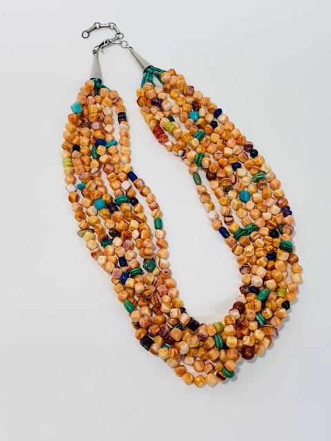My client purchased this multi-strand spiny oyster necklace while on vacation in Arizona.  Unfortunately, she felt the necklace was too heavy for her and never wore the piece.  She was very specific with what she wanted the necklace turned into.  