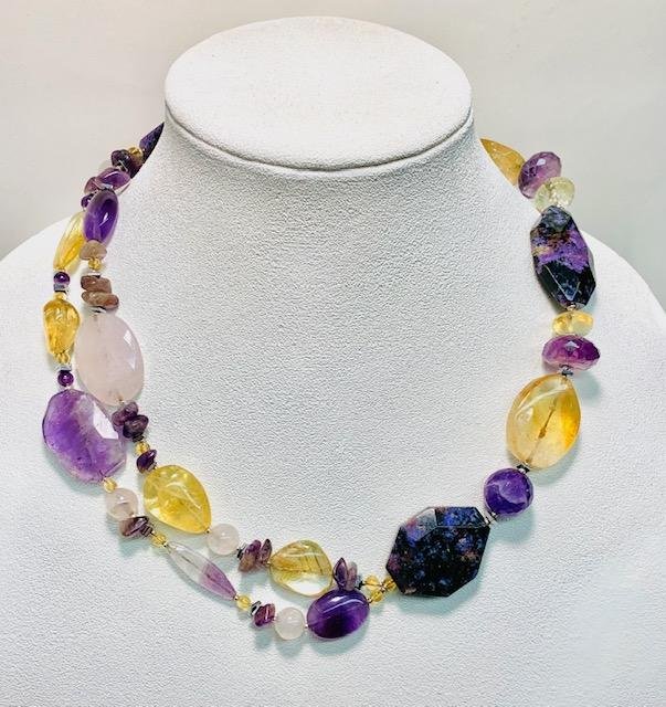 After- as the stones were mismatched and an uneven count, I used some complementary gemstones to balance out the piece.  I also used large pieces of charoite in order to add a more contemporary feel to the piece.  