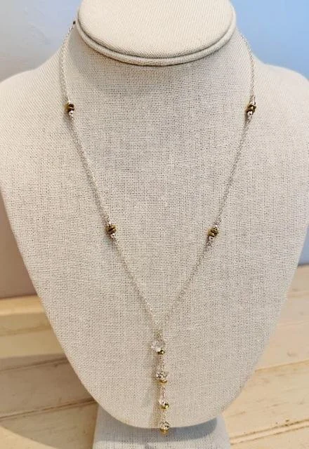After:  I presented several ideas when we were discussing changing the design of the piece.  My client wanted to keep the dangle part.  I changed the entire chain and built a sterling silver one with brass and ss embellishments throughout.  Each Herk