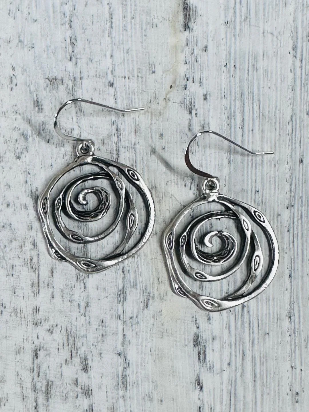 swirl silver earrings flat.jpg
