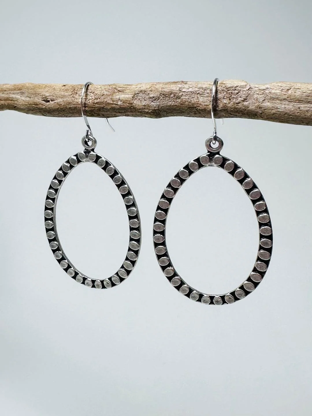 hammered circle flat teardrop hoops side.jpg