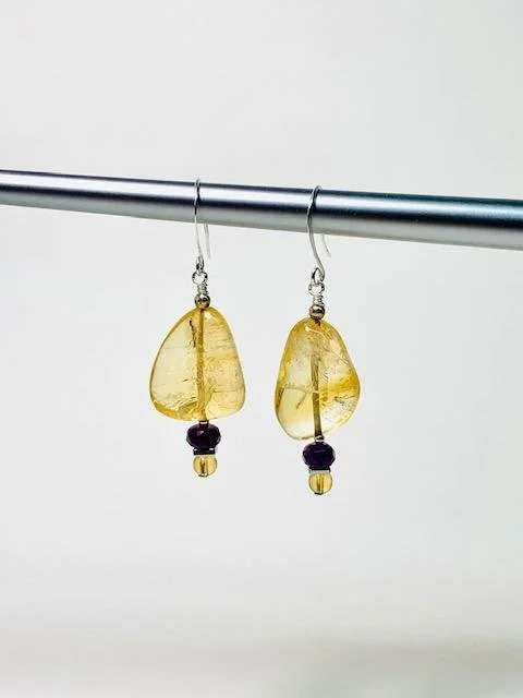 I was able to closely match citrine stones from the deconstructed necklace to make a matching pair of earrings.  I added gem cut amethyst to them so they complete the set nicely.  