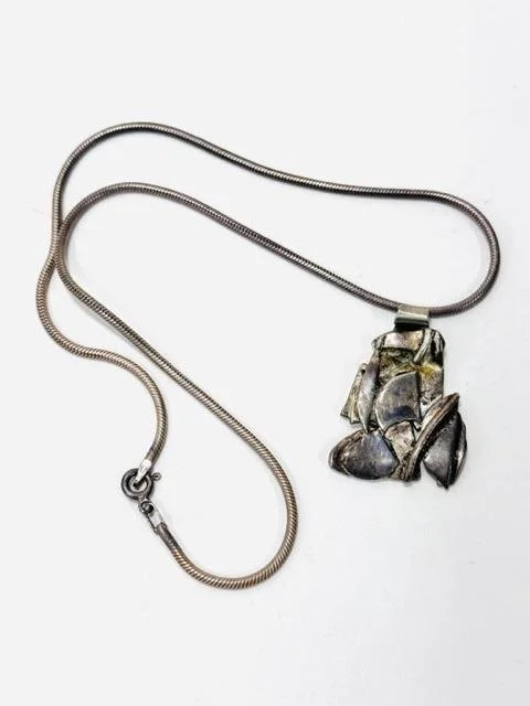 Before:    1/8- original sterling silver snake chain and pendant.  Sentimental as her mother in law made the pendant and she is no longer with us.  