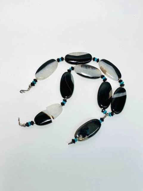 A client contacted me as she had a necklace that her mother in law made for her and unfortunately one of the stones cracked in half.  We discussed various options regarding types of repair/redesign ideas.  Thankfully, I was able to help her bring the