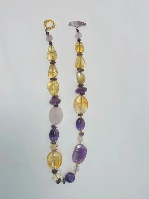 Before- a mismatched strand of varying semi-precious stones.