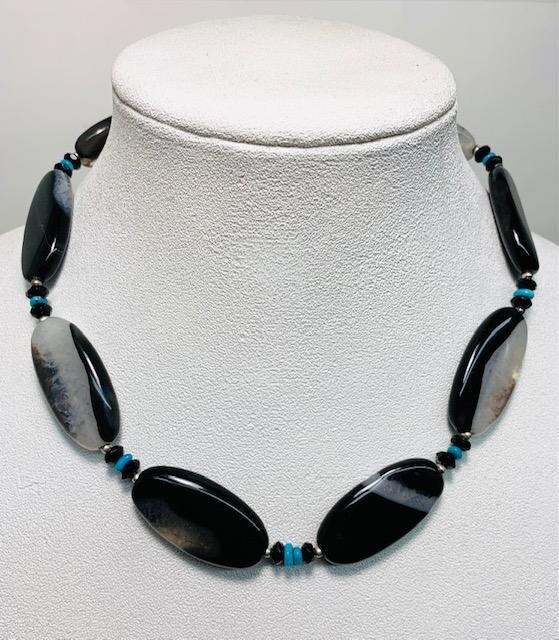 Finished piece.  I removed the original pendant and was able to utilize it as a replacement for the cracked stone.  I added some extra beading to make up for some sizing.  