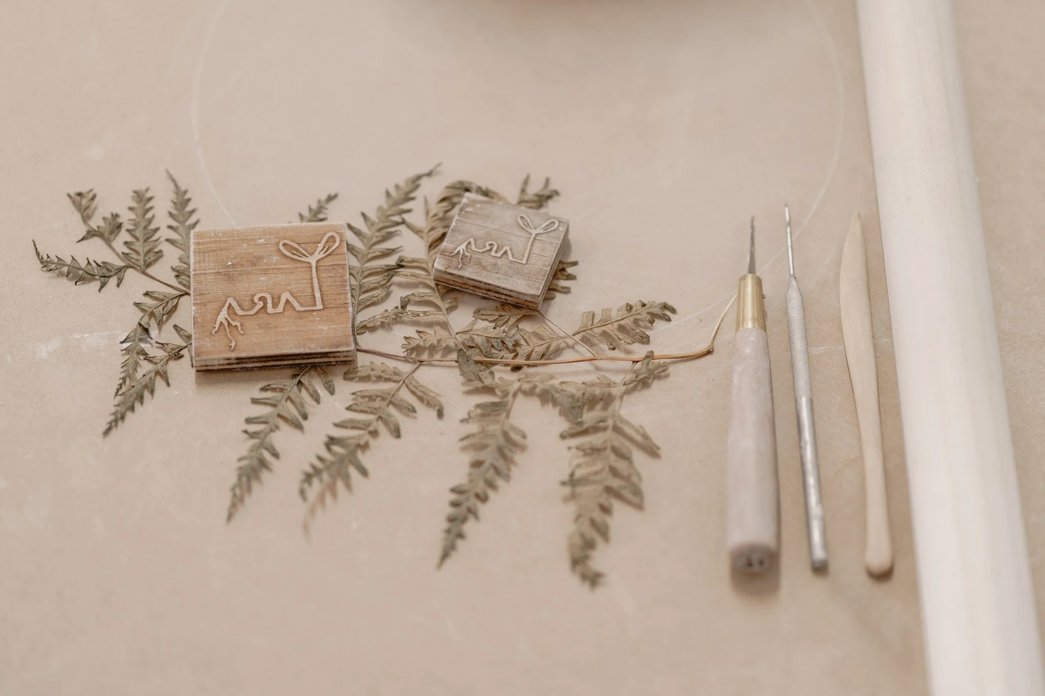 Ceramic tools with clay stamps and dried leaf