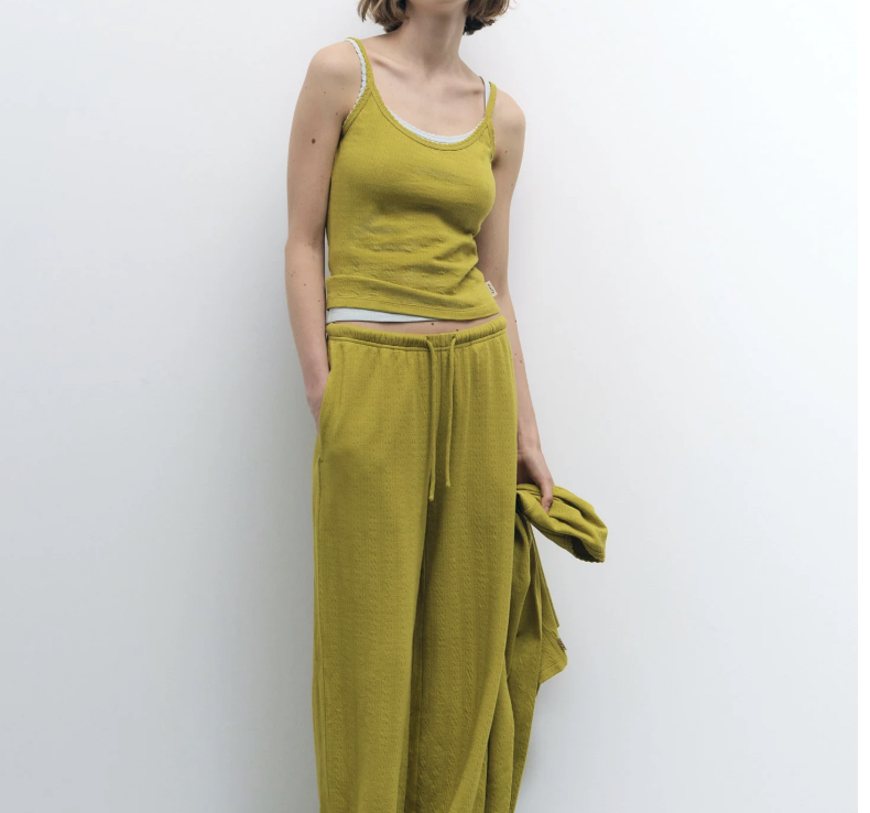 woman modeling a mustard yellow sweatsuit