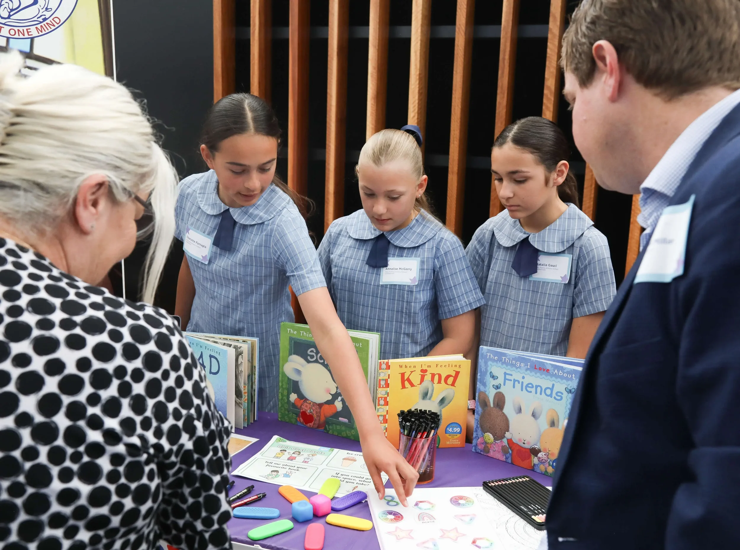 Three students from Holy Family Luddenham school present their project to members of the community at Gotcha4Life's Mental Fitness Leaders of Tomorrow event.