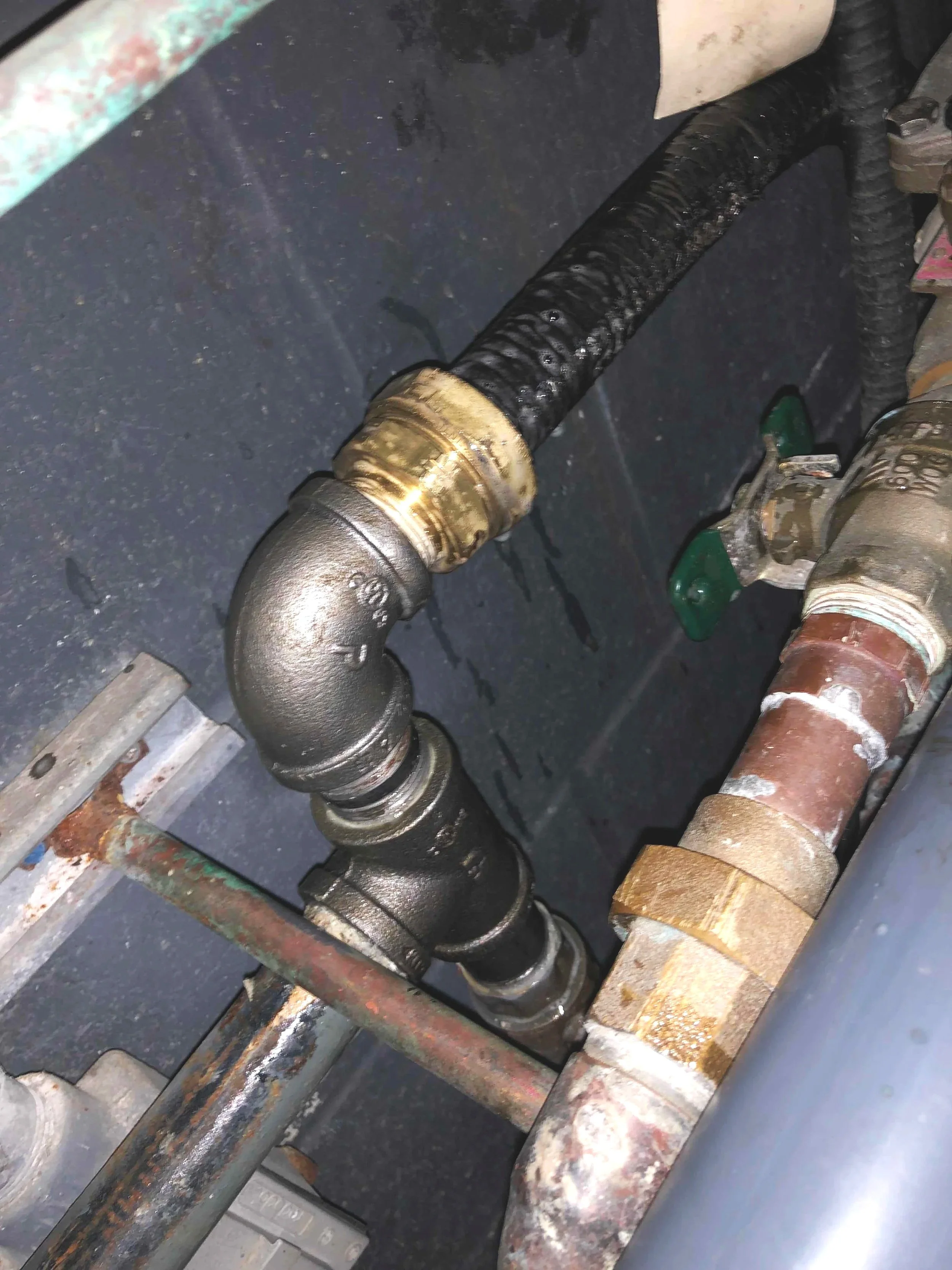 Close-up of a series of pipes, showing the installation process.