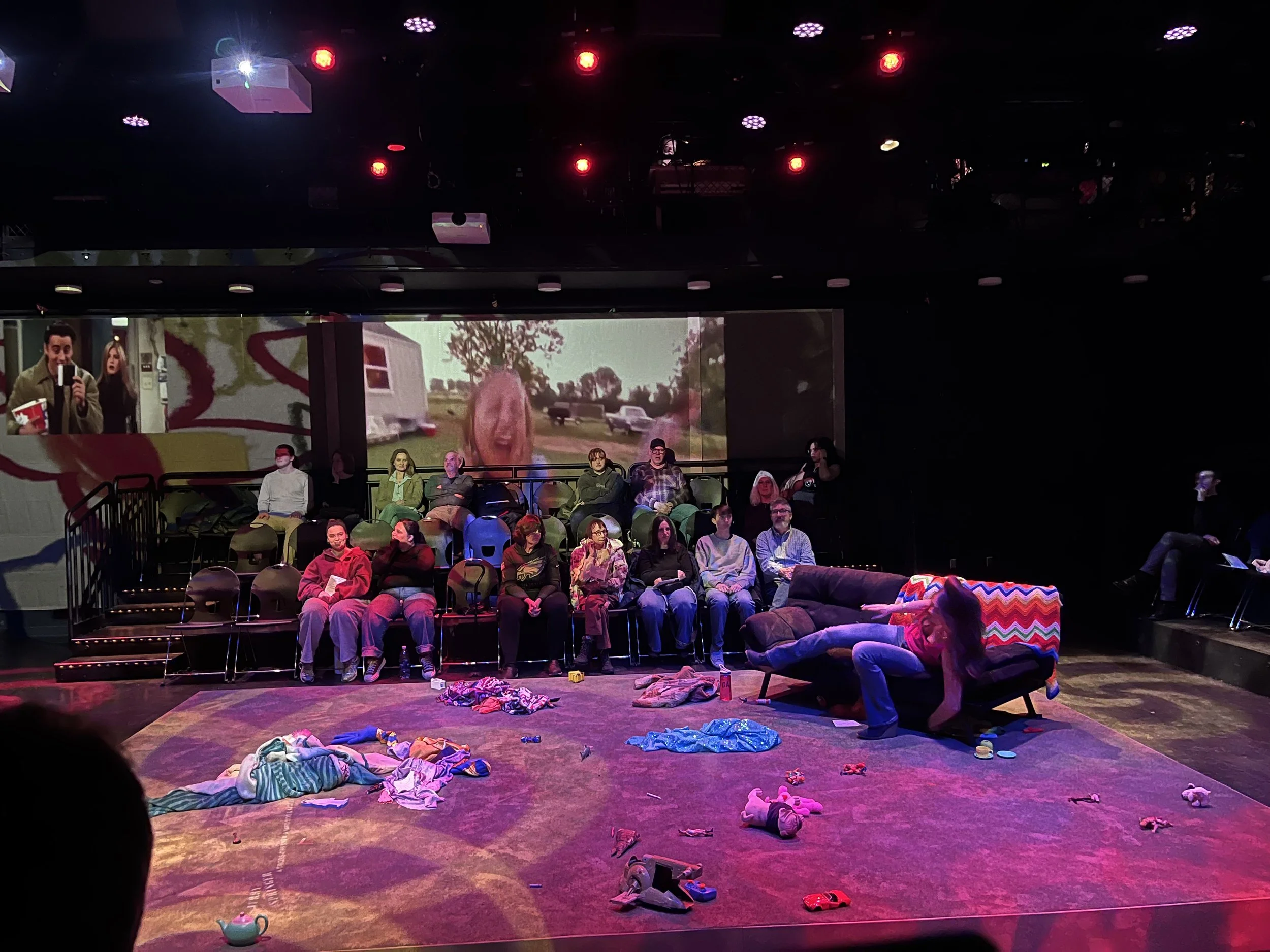 90's TV shows, like Jerry Springer, were projected around the room to add to the chaos of the scene