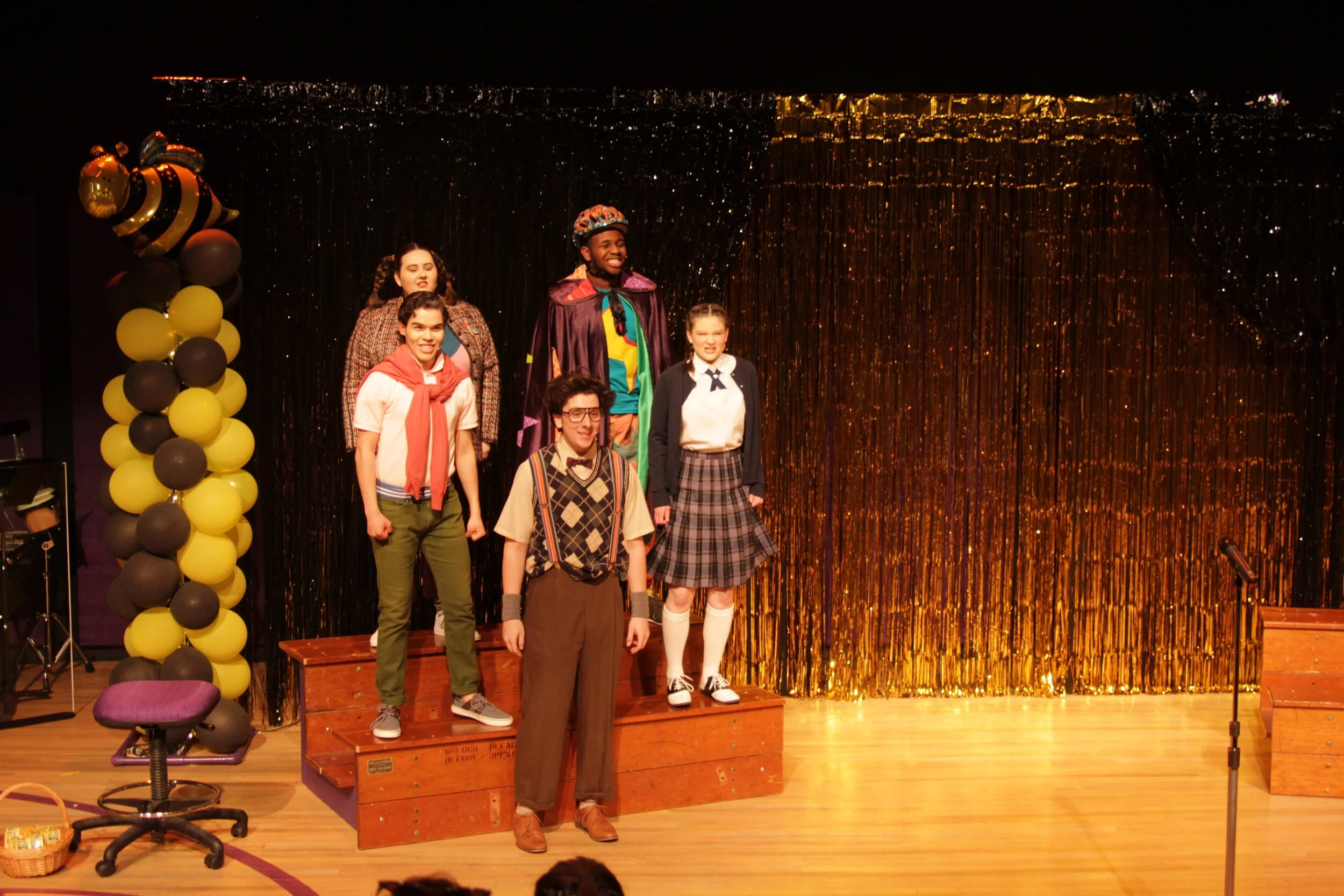 Our cast singing on the risers made from the bleacher wood from the Moffett courts