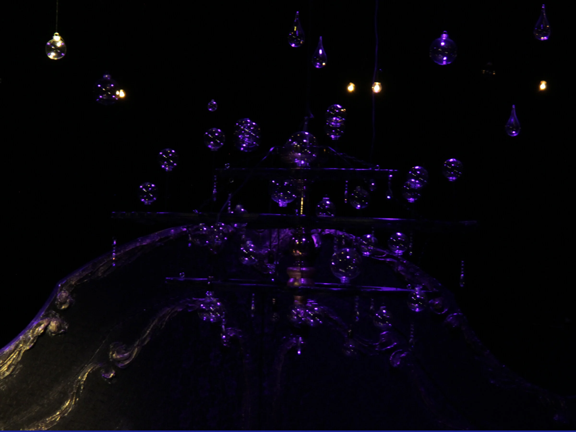 chandelier with hanging globes and twinkle lights