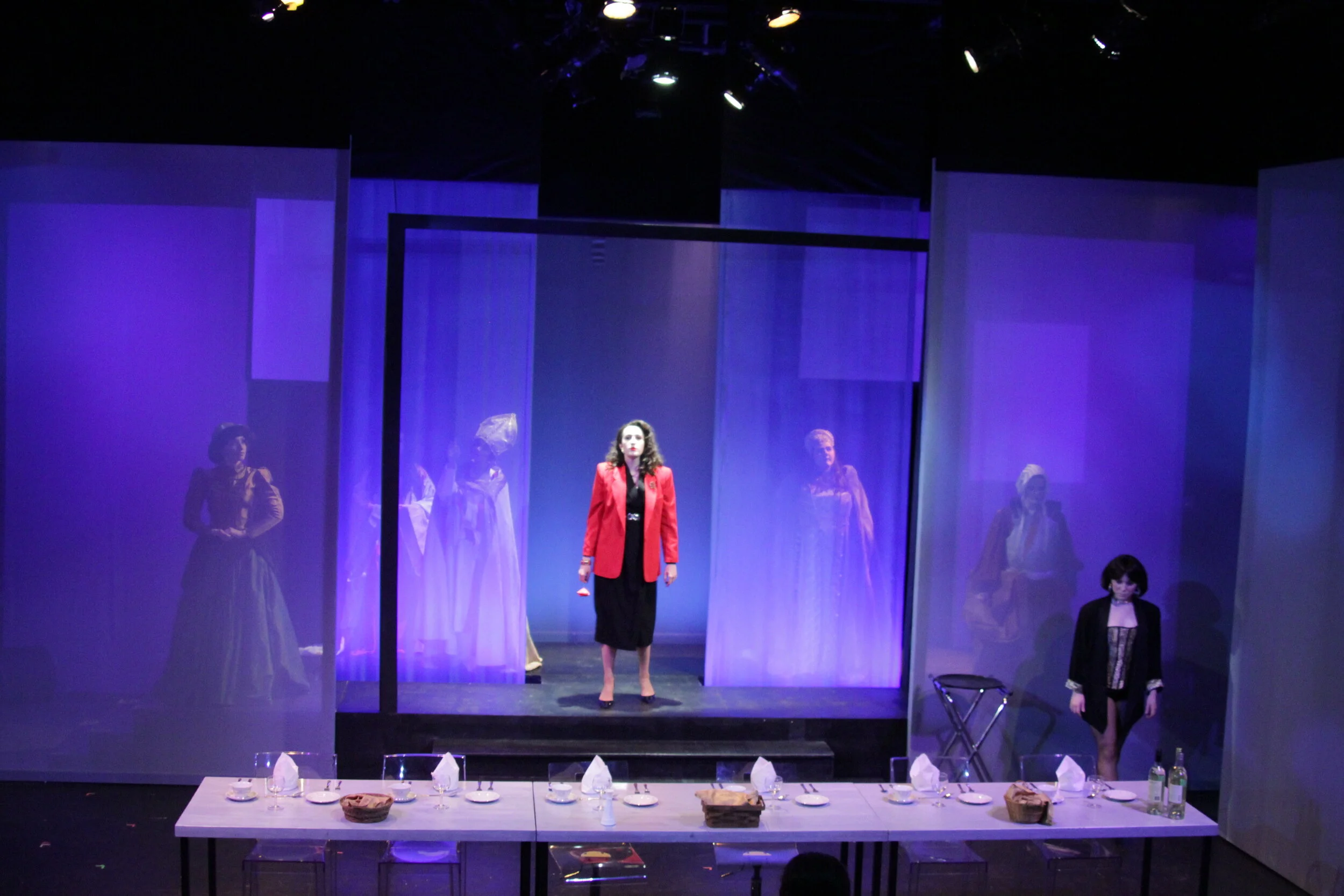 Prod photo: Dinner Party.  Historical women figures enter Marlene's dream for a raucous conversation