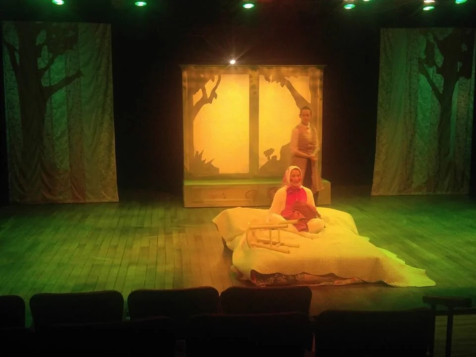 Dreaming of the woods.  The velveteen rabbit comes to life.  The upstage curtains were translucent and had large cutouts of trees behind.