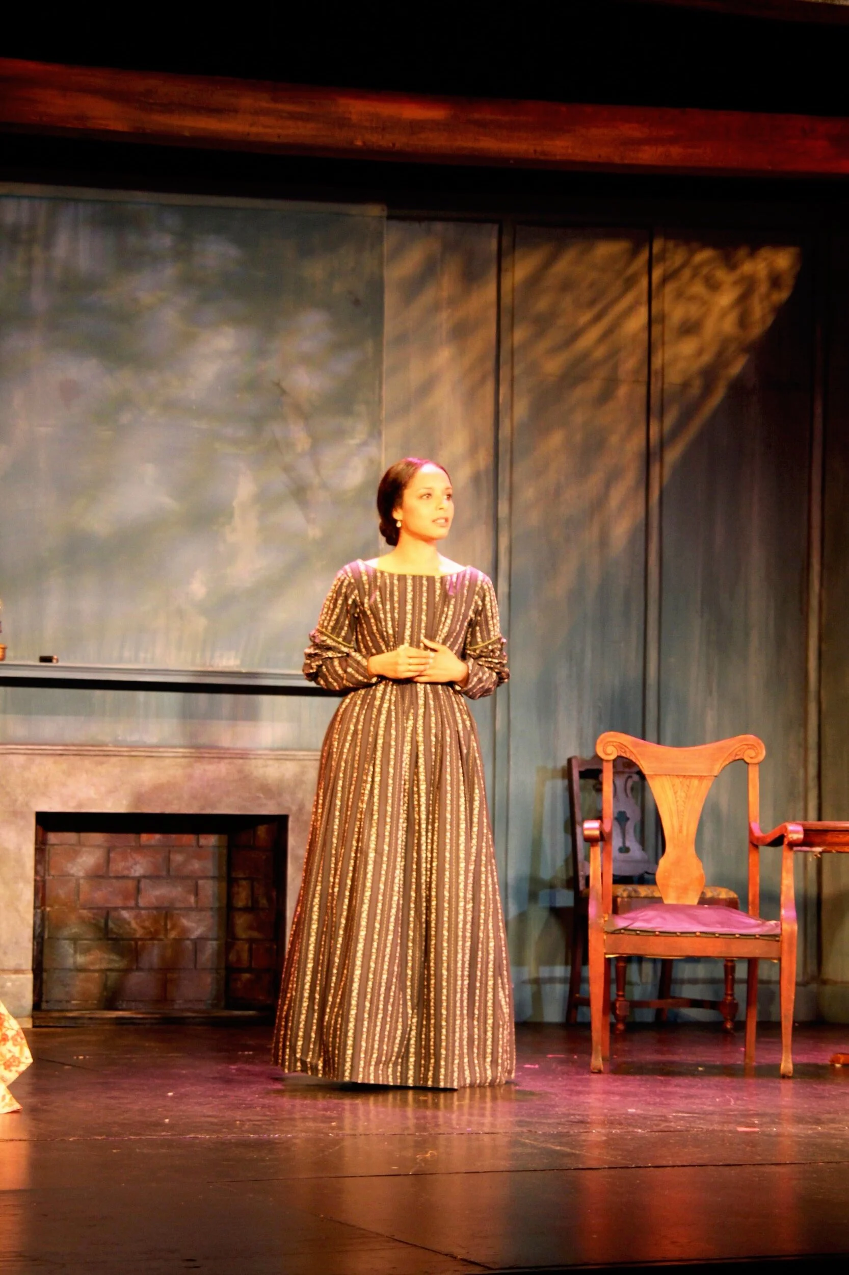 Prod photo: slave market.  As Harriet recounts her days in the market the lighting built up around her and became very warm like the blistering southern sun.