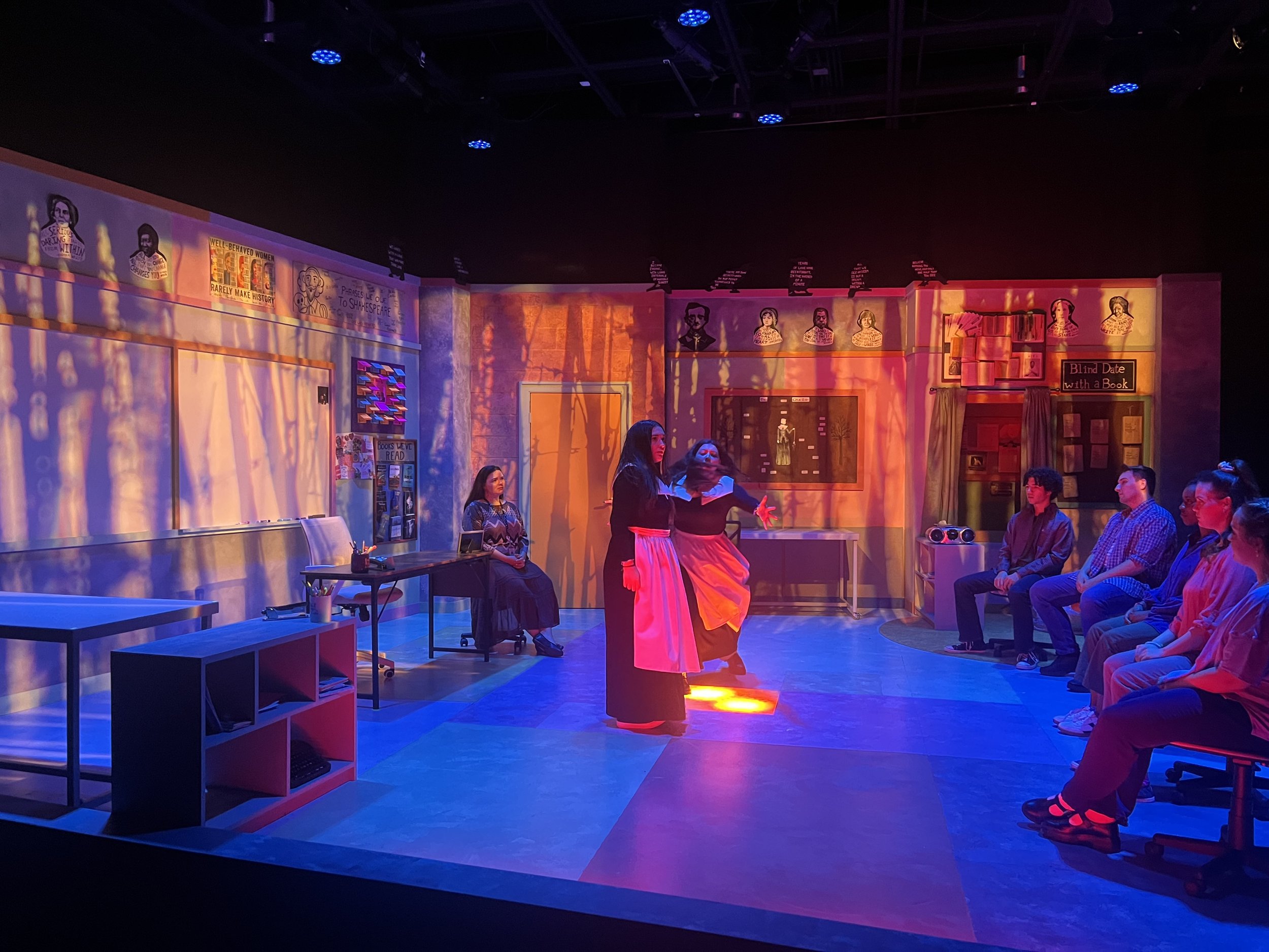 The students break out into a rage filled dance like the girls in The Crucible- Projections transformed the space into woods and eventually flames