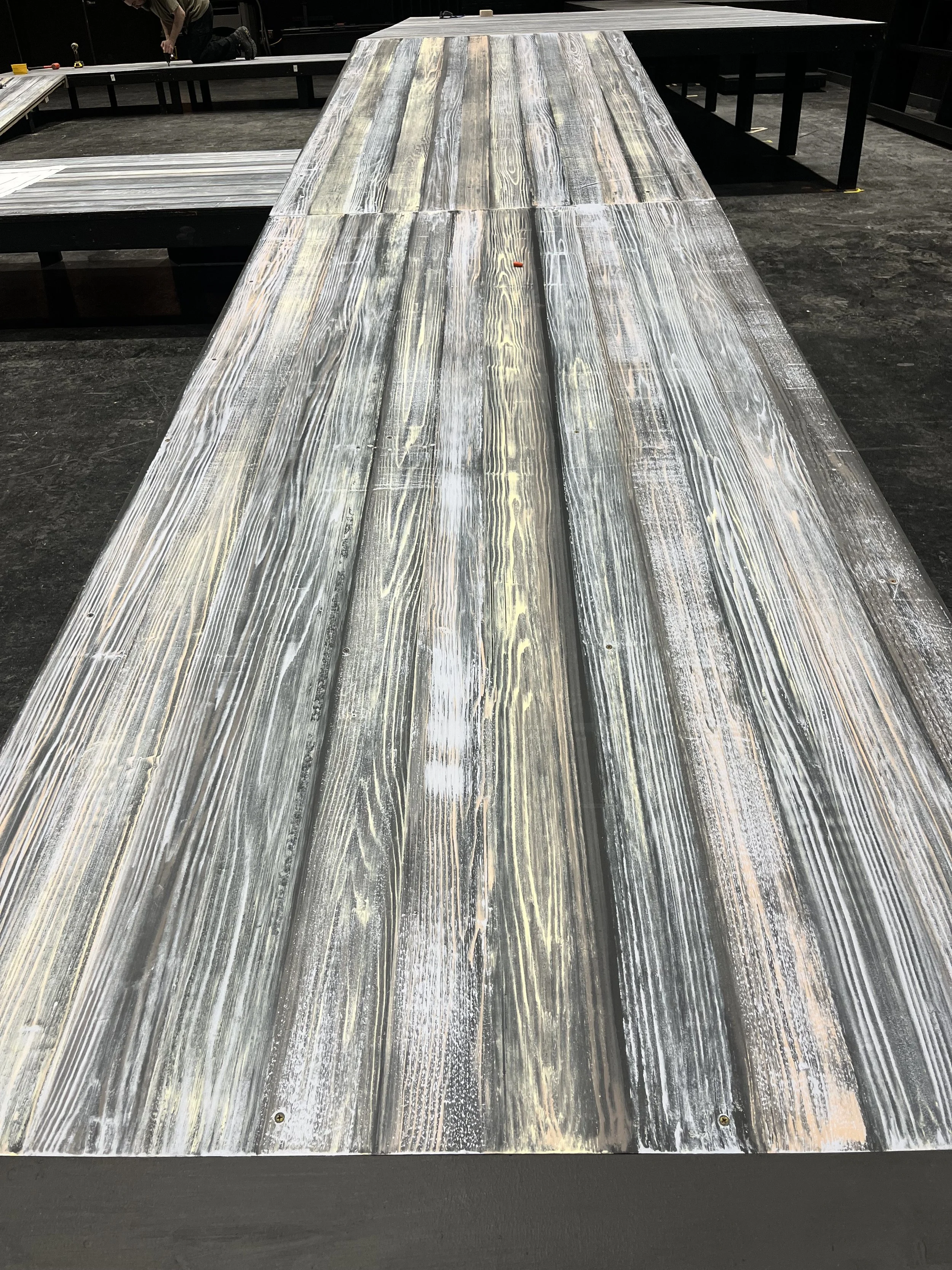I painted the deck to resemble a weathered boardwalk where they first met