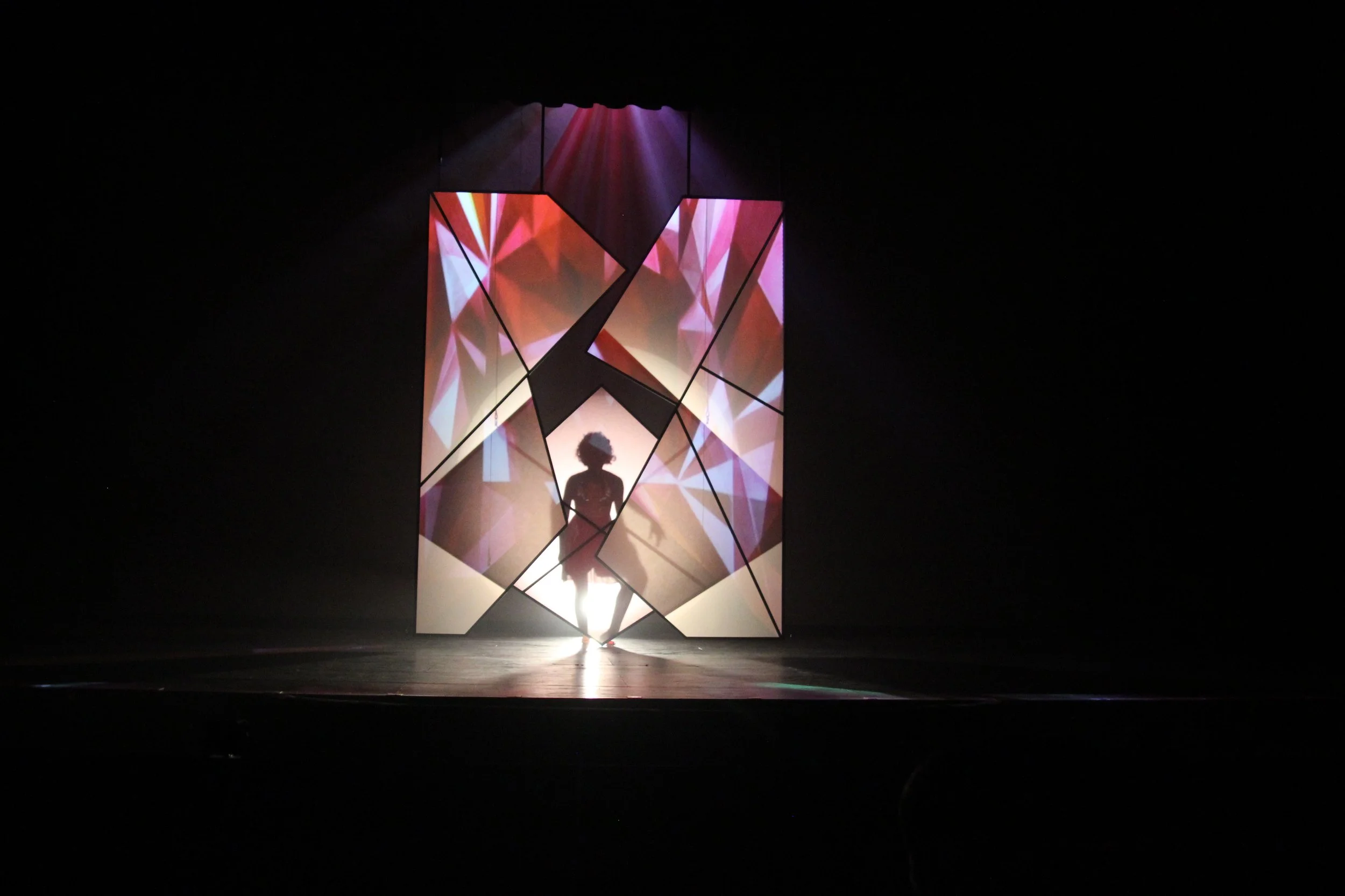 Opening Number- Charity is revealed behind the gemstone panels which open up and transform the space.  