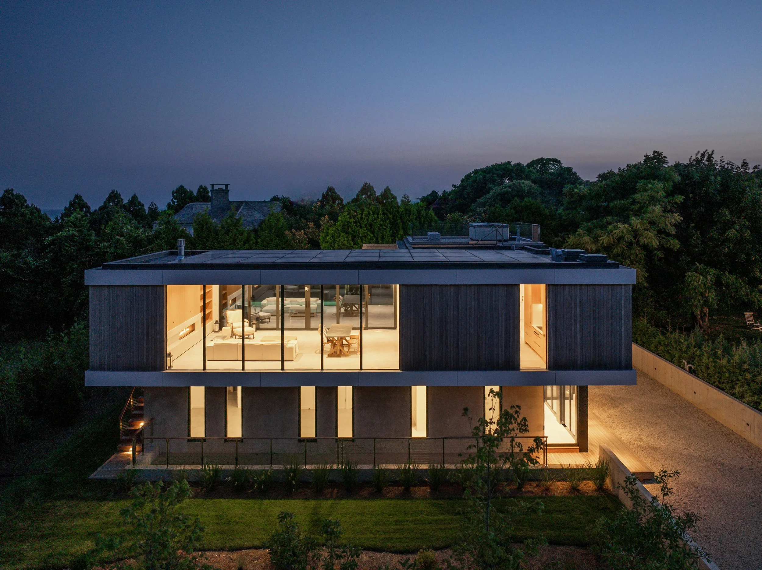 bda_jackson-rd-residence_modern-residence-at-night-blue-hour-aerial.jpg