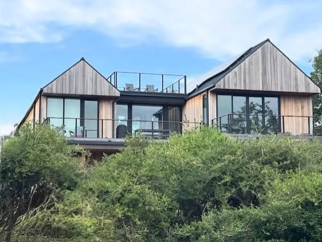 The Widows Walk, historically is a roof level lookout used to see if sea faring mariners were returning home. Our rooftop deck, nestled between two gables is a more relaxed elevated perch from which one may take in the rhythms of the sea.

#moderngab