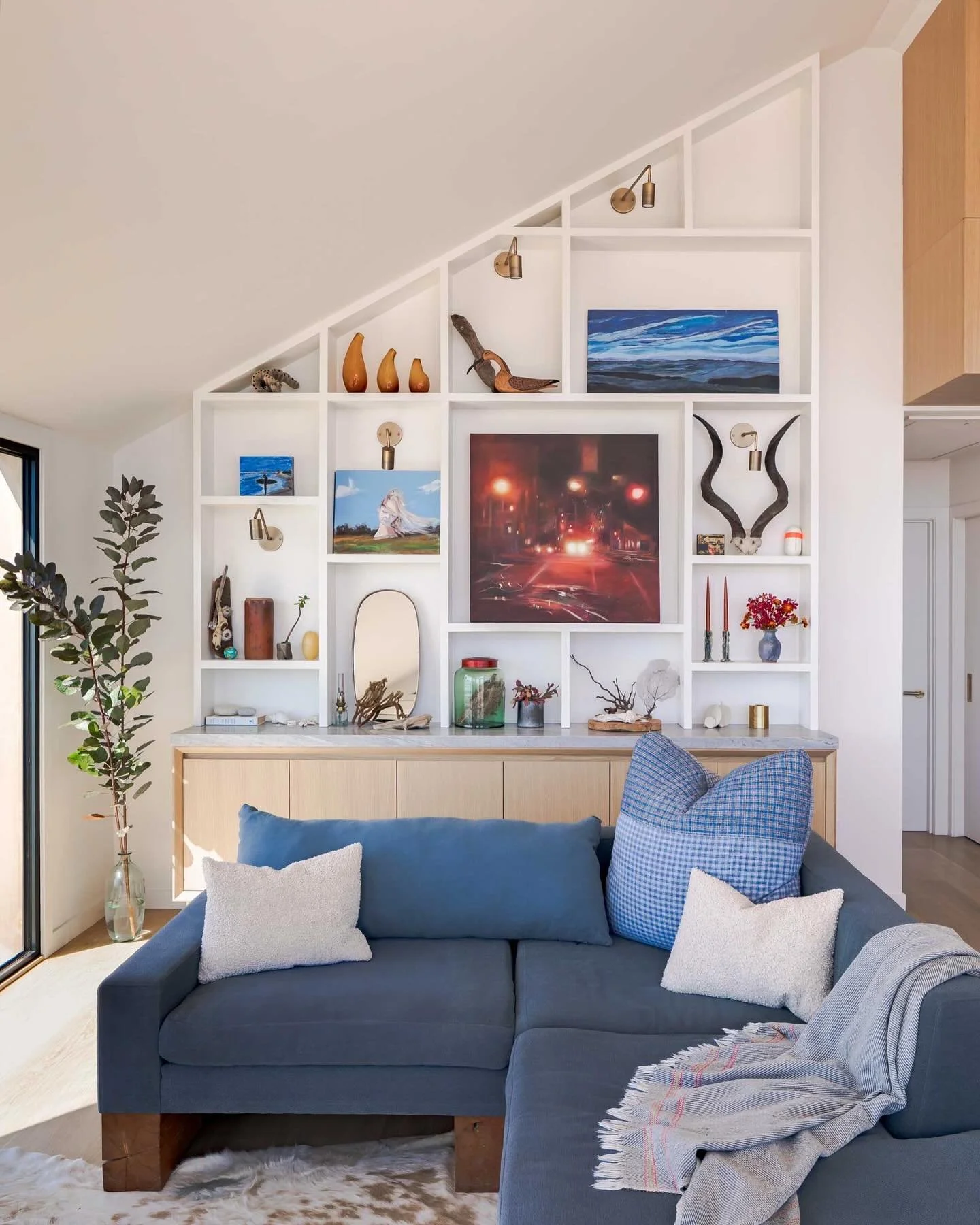 The devil is in the details; custom credenza and book case showcase the owners paintings and objet as a cozy foil for the expansive water views.

#modernfurnishings
#moderninteriordesign
#customfurniture
#moderndesign
#innovativedesign 
#amagansett
#