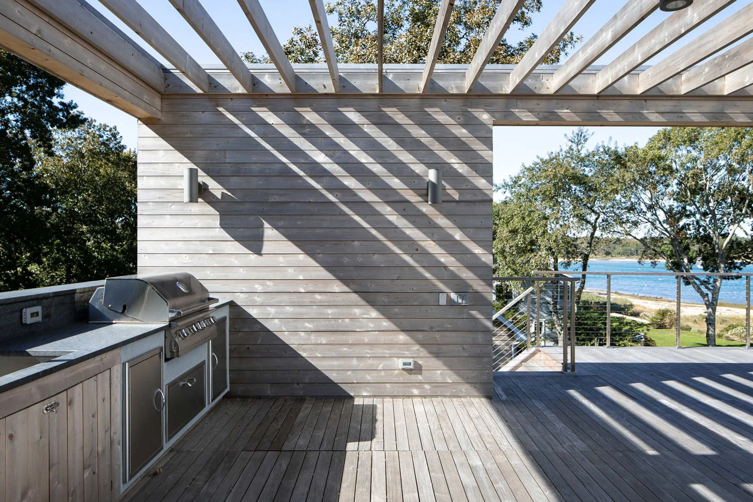 Rooftop terrace with pergola, outdoor kitchen, and panoramic views
