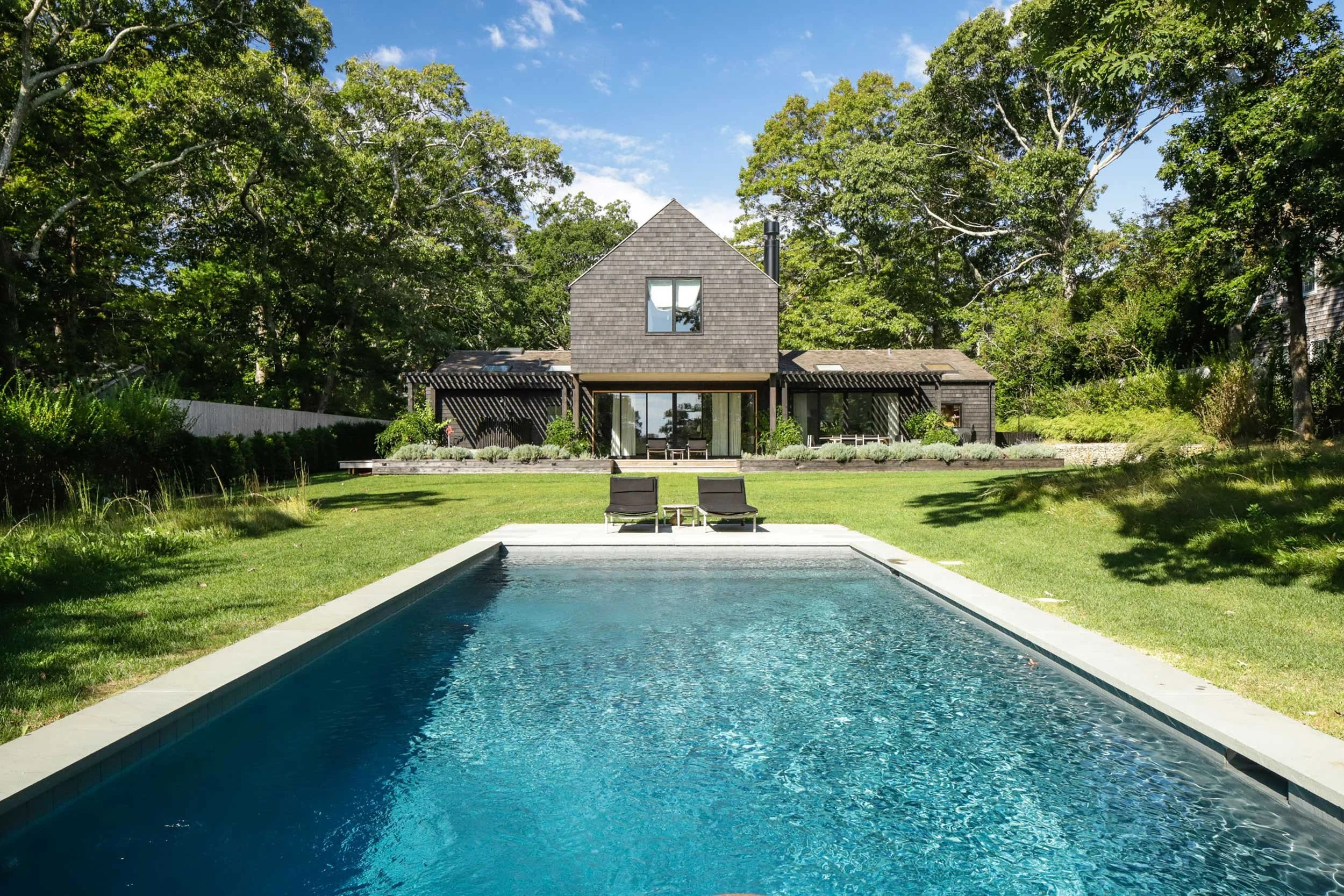 East Hampton coastal home with pool and contemporary black-clad façade