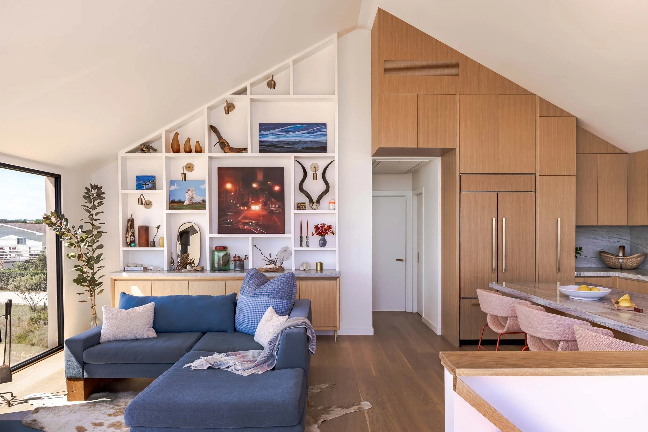 White oak custom cabinetry in Shore Drive Residence contributing to luxurious, resilient interior design
