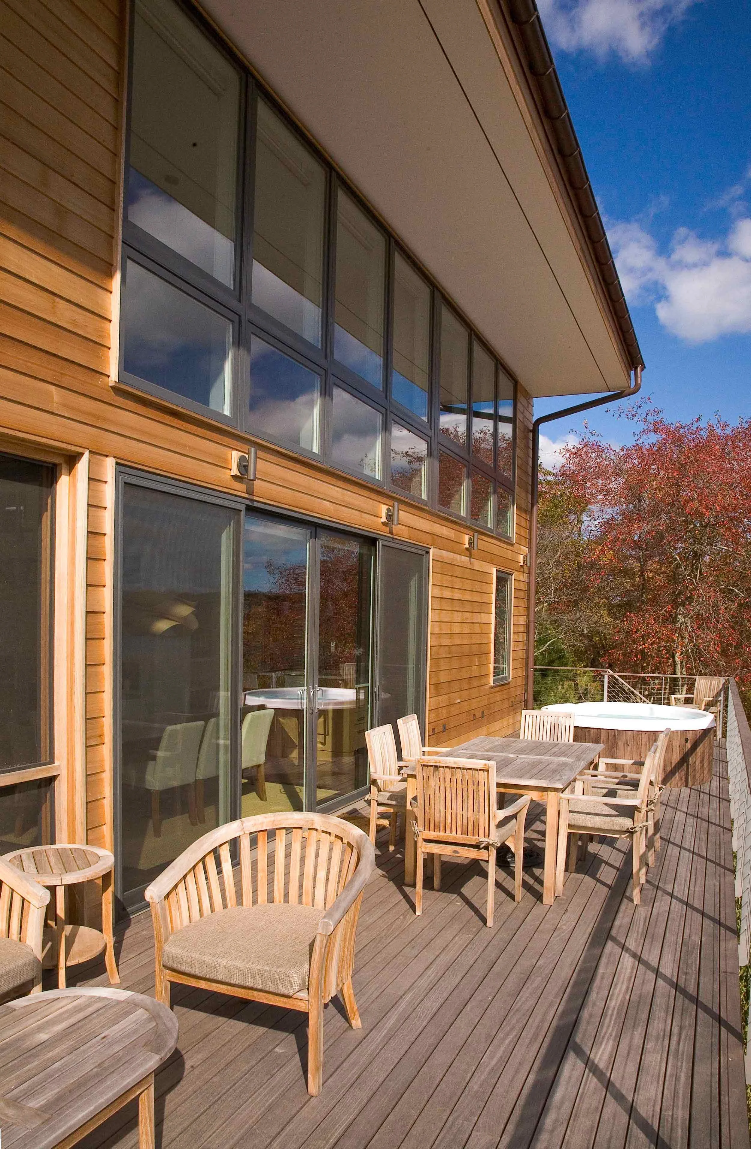 Expansive deck at Great Pond Residence emphasizing indoor-outdoor coastal living