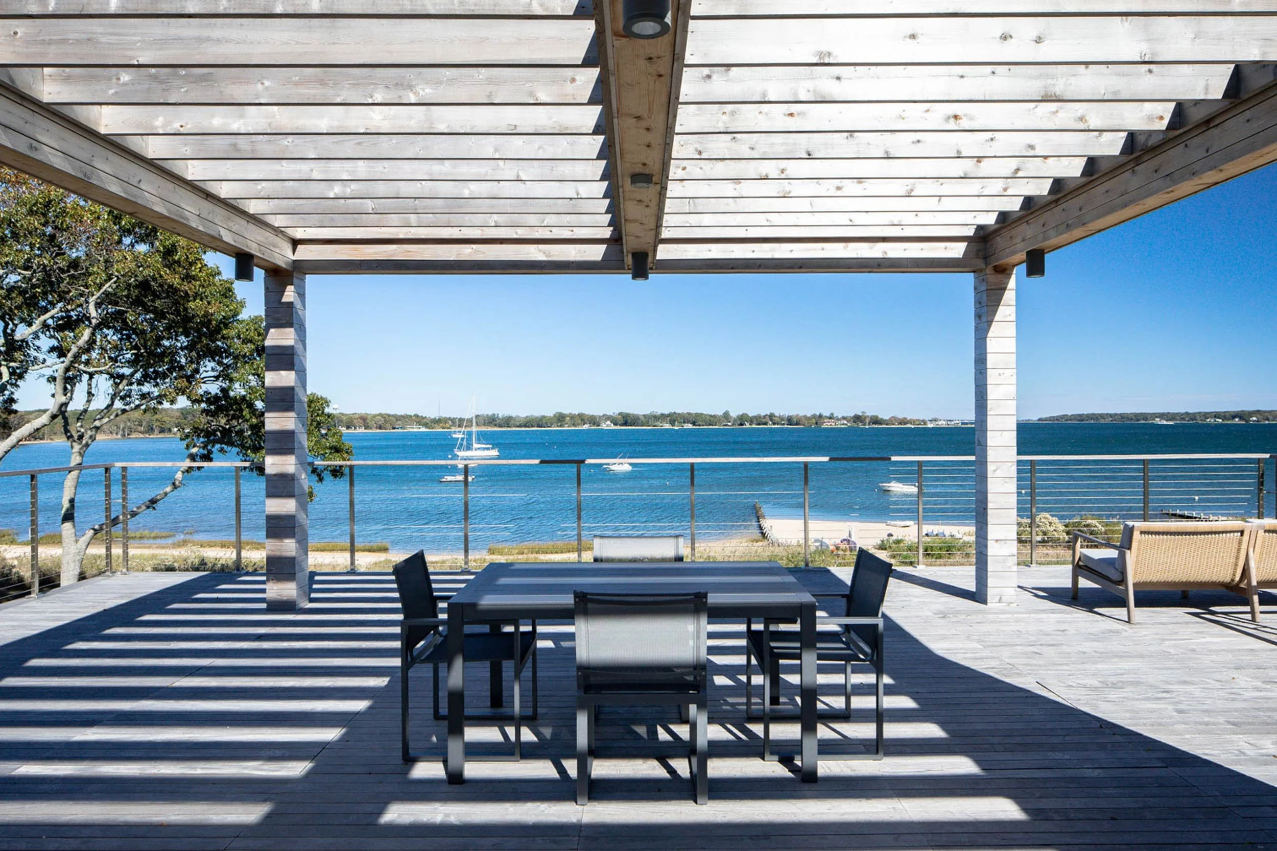 Rooftop terrace with pergola, outdoor kitchen, and panoramic Shelter Island Sound views