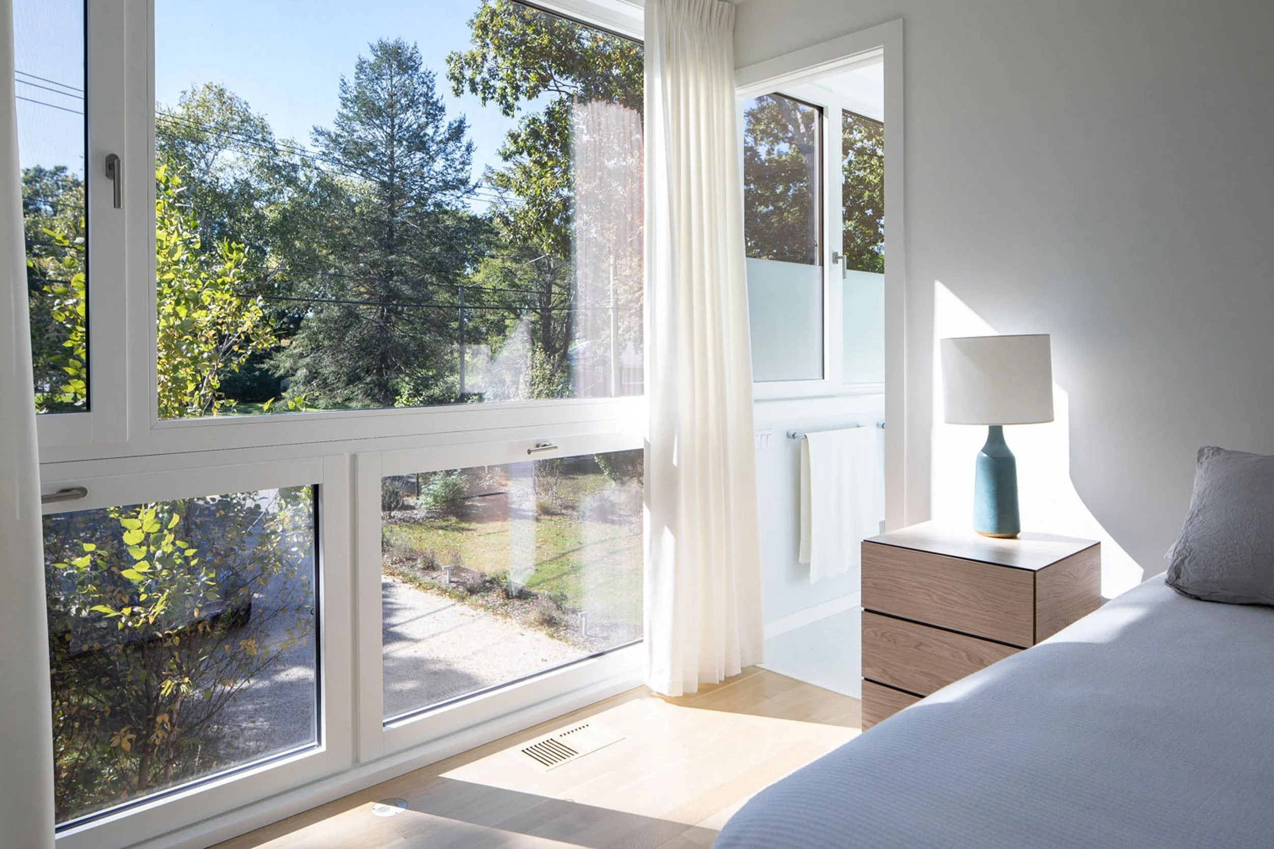 Resilient coastal retreat with restrained material palette and European windows, North Fork Long Island