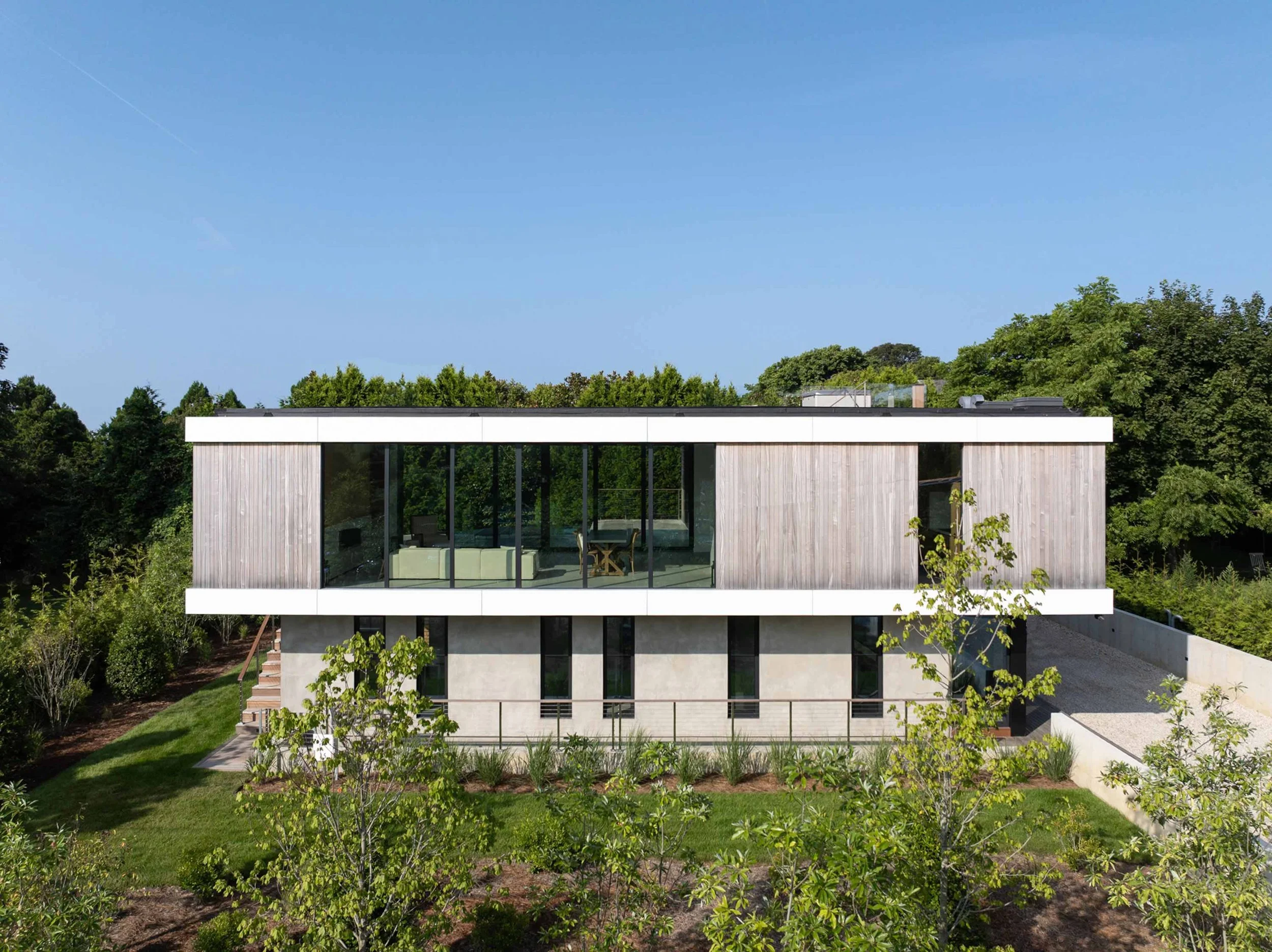 Jackson Road Residence elevation view with custom mahogany siding, fiber cement panels, and stucco, East Hampton