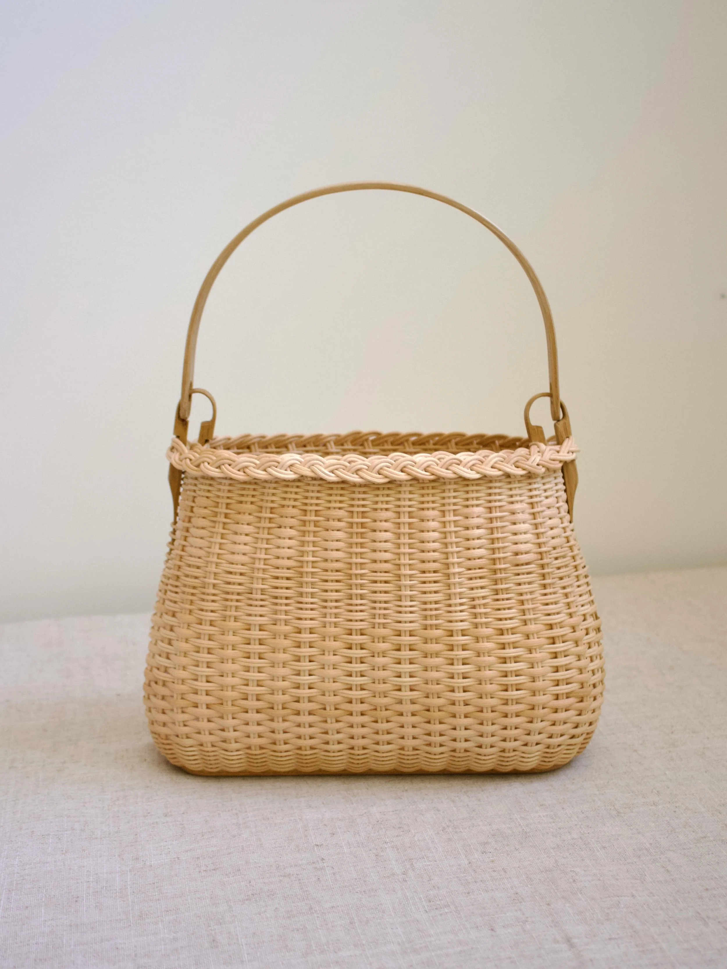 I took a few years off from making bags until it excited me again. We&rsquo;re back! Round reed is lending itself to subtle patterns, braided rims, and a generally more enjoyable process for me. This one and a couple others will be available tomorrow